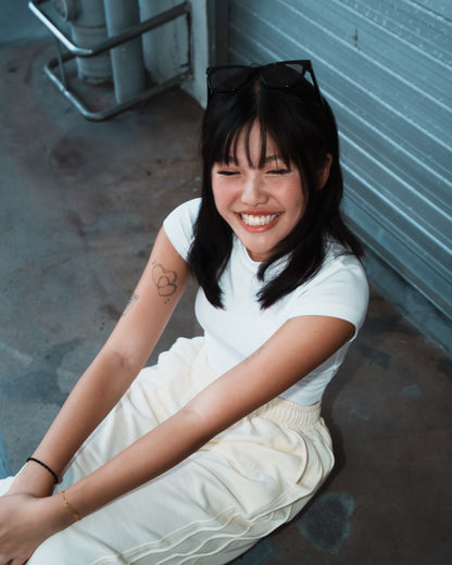 PLEATED SWEATPANTS — CREAM EDITION